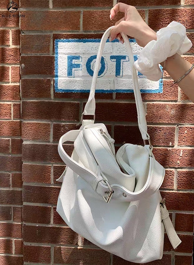 بليه روان شنطة هوبو نسائية باللون الأبيض بتصميم حديث مع تفاصيل الحزام، مصنوعة من جلد صناعي ناعم ومتين. توفر مساحة واسعة تناسب احتياجاتك اليومية سواء للعمل أو الجامعة أو السفر. تأتي مع حزام طويل قابل للتعديل للارتداء ككروس بودي، بالإضافة إلى جيوب داخلية للتنظيم المثالي. خيار رائع للسيدات الباحثات عن الأناقة والعملية في شنطة واحدة. - Image 1