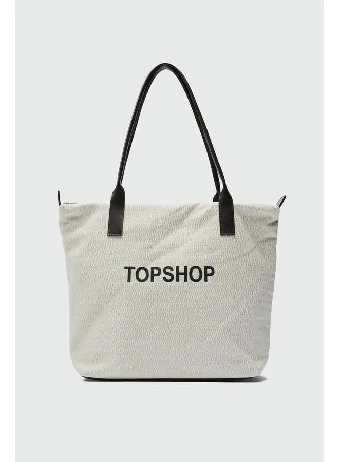 شولي باجس حقيبة كتف كبيرة الحجم من كانفاس بوشز باللون الأسود.