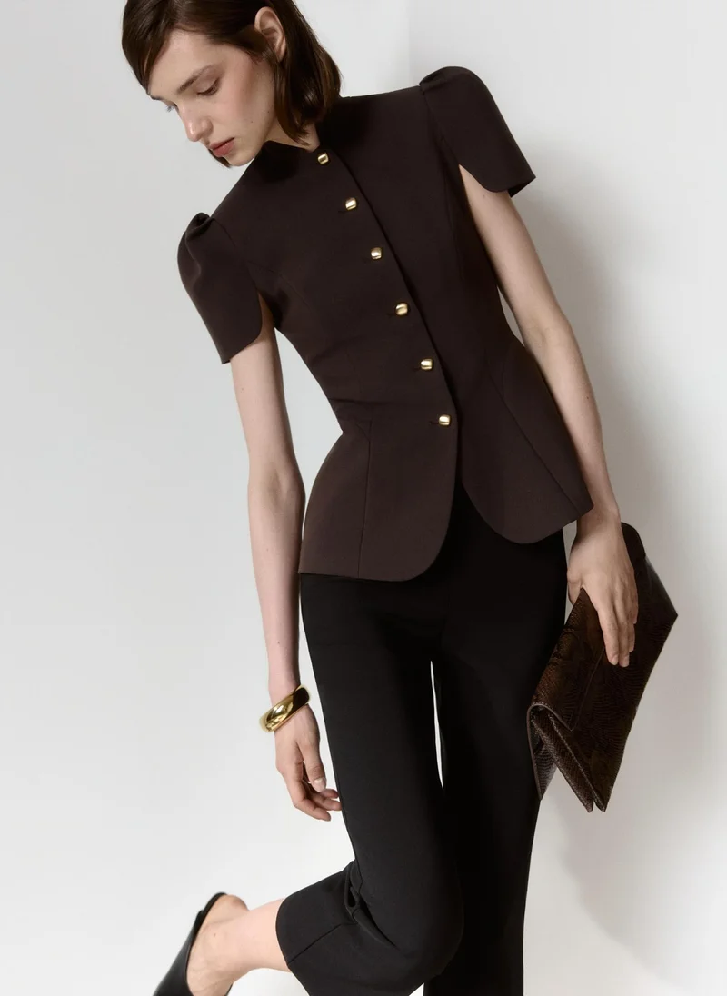 Fitted jacket with a stand-up collar and voluminous sleeves