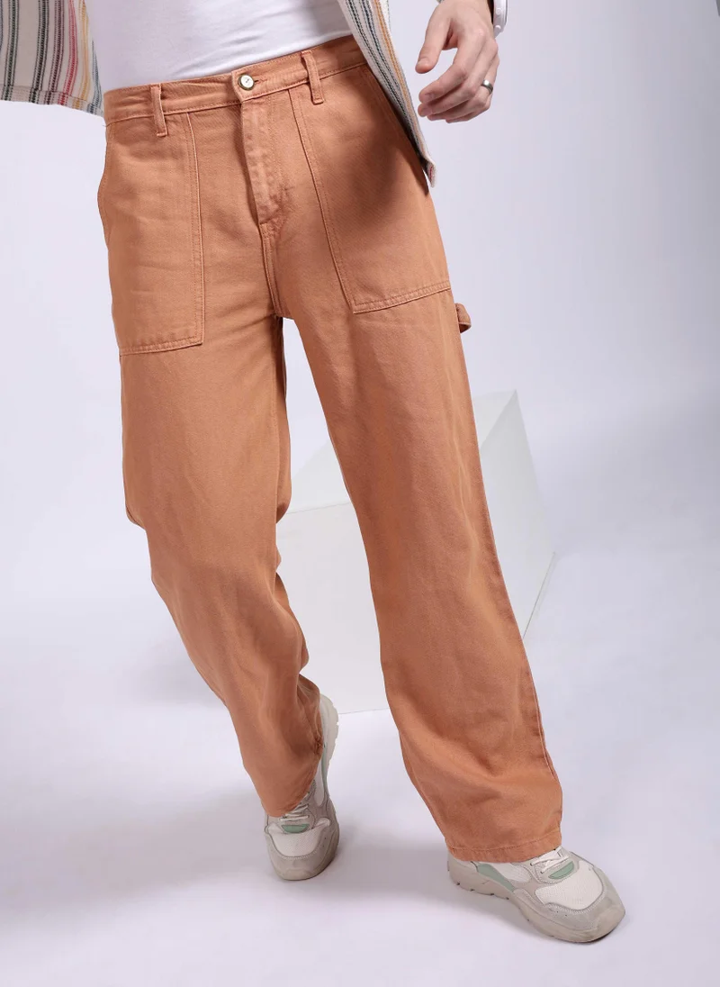 ذا انديان كراج كو Men Baggy Solid Mid-Rise Stretchable Jeans