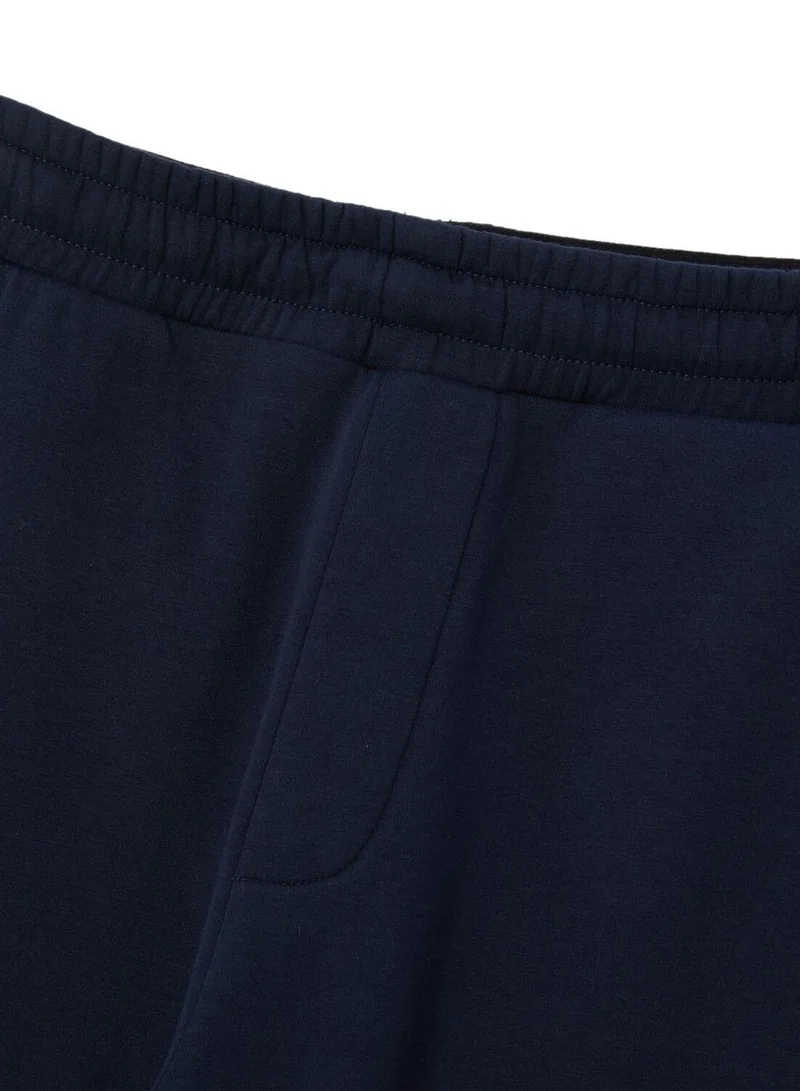 GIORDANO  Men's Slim Taper Mid-Rise Cotton Blend Knit Jogger Pants for Men | Best Price UAE