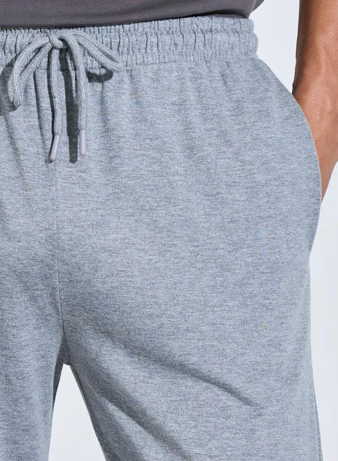 Styli  Men Grey Solid Relaxed Fit Knitted Pants for Men | Best Price UAE