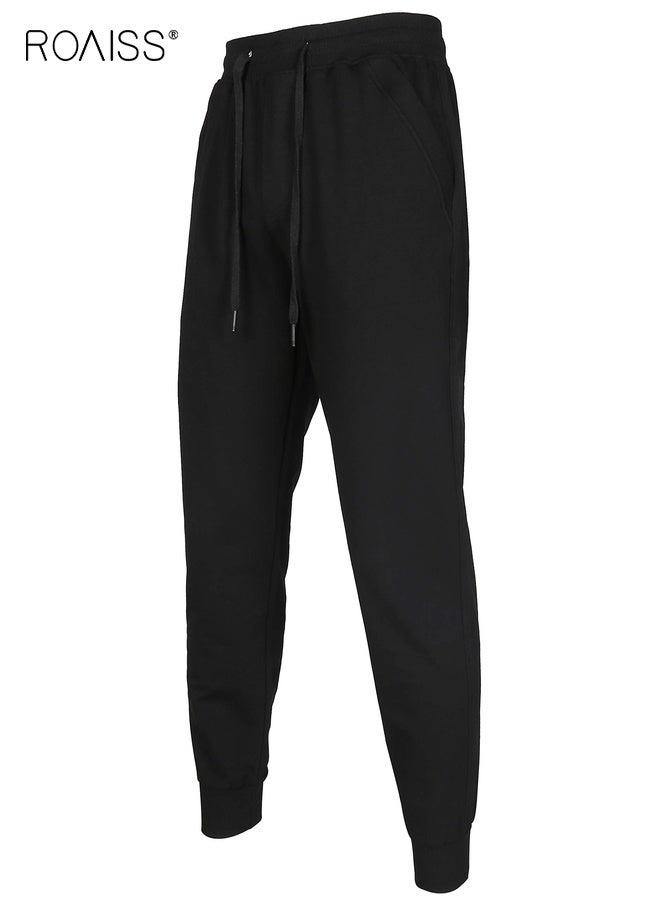 رويس بنطال رياضي رجالي من القطن بقصّة عادية ورباط للإغلاق وخصر مرن وجيوب بسحّاب، بنطال رياضي خارجي فضفاض بقصّة مستقيمة، باللون الأسود النقي - Image 1