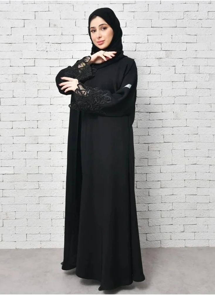 lamha abaya Elegant black wrap abaya with a prominent orchid flower design on the sleeves