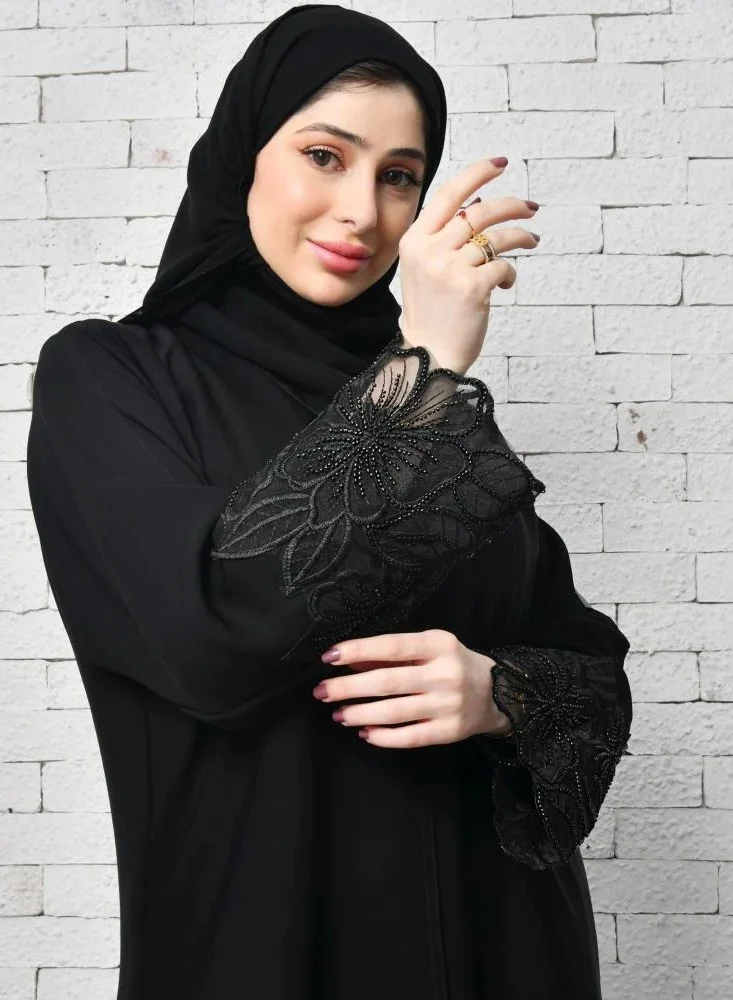 عبايات لمحة عباية لف سوداء راقية بكلفة بارزة على شك وردة الاوركيد على الاكمام