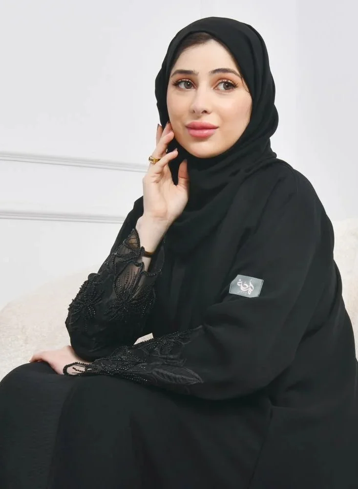 عبايات لمحة عباية لف سوداء راقية بكلفة بارزة على شك وردة الاوركيد على الاكمام