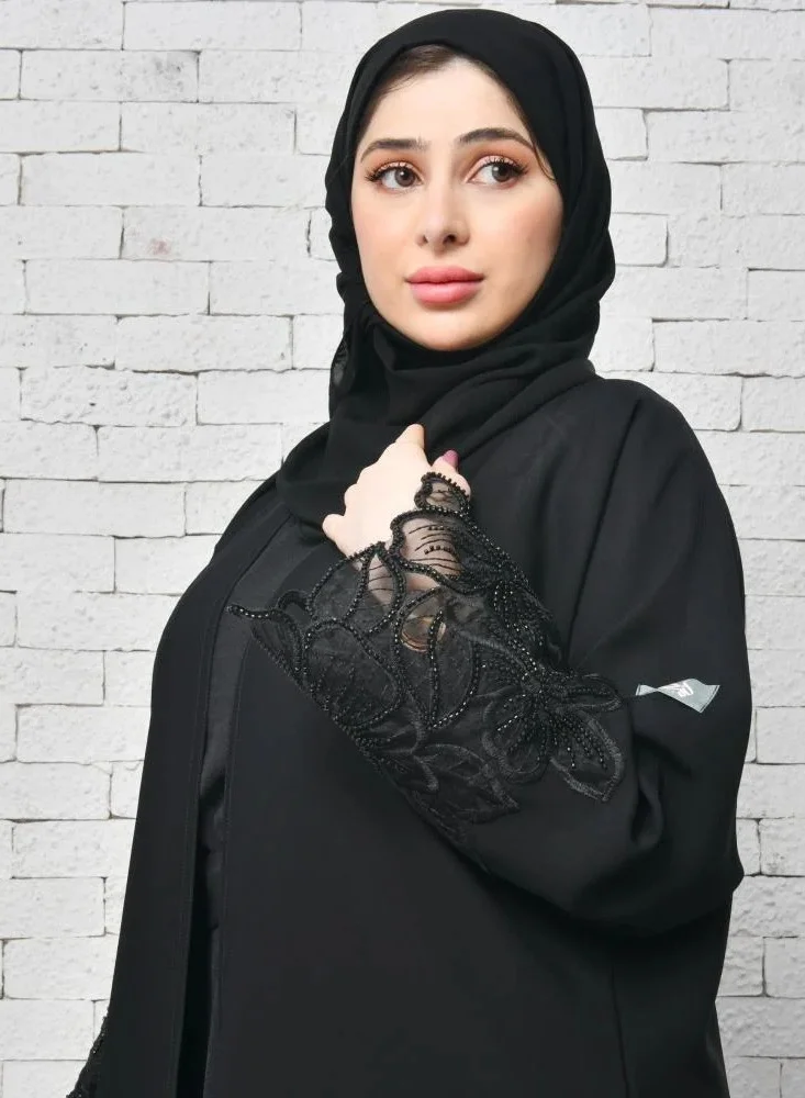عبايات لمحة عباية لف سوداء راقية بكلفة بارزة على شك وردة الاوركيد على الاكمام