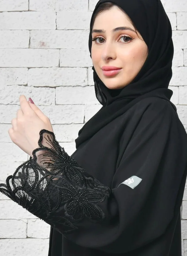 عبايات لمحة عباية لف سوداء راقية بكلفة بارزة على شك وردة الاوركيد على الاكمام