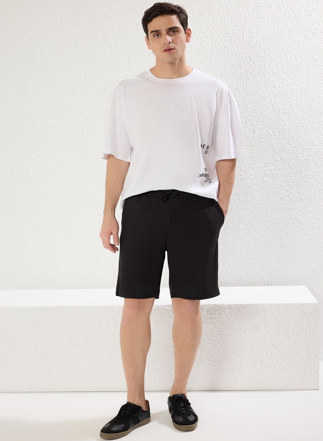 trendyol Premium Black Oversize/Wide Cut Textured Wrinkle-Free Ottoman Shorts - Image 1