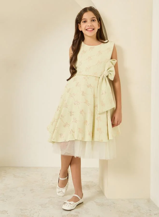 ستايلي فستان جاكار بلا أكمام وبتفاصيل عقدة