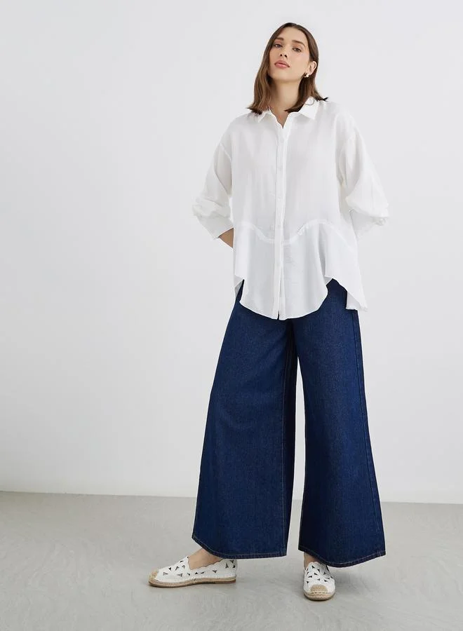 تايك تو قميص نسائي أبيض سادة بأكمام طويلة فضفاض بحافة غير متماثلة