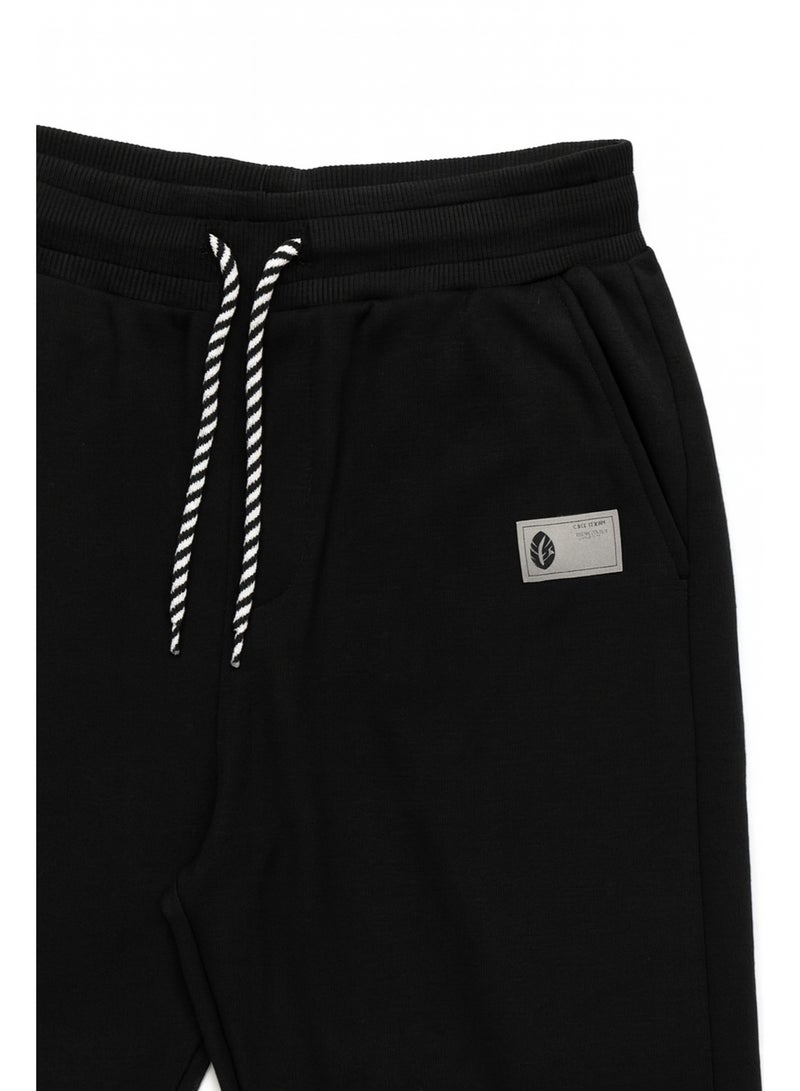 شي إن بنطلون جوجر للأولاد خامة قطن + لايكرا – أسود مقاس 11–12 سنة - Image 2