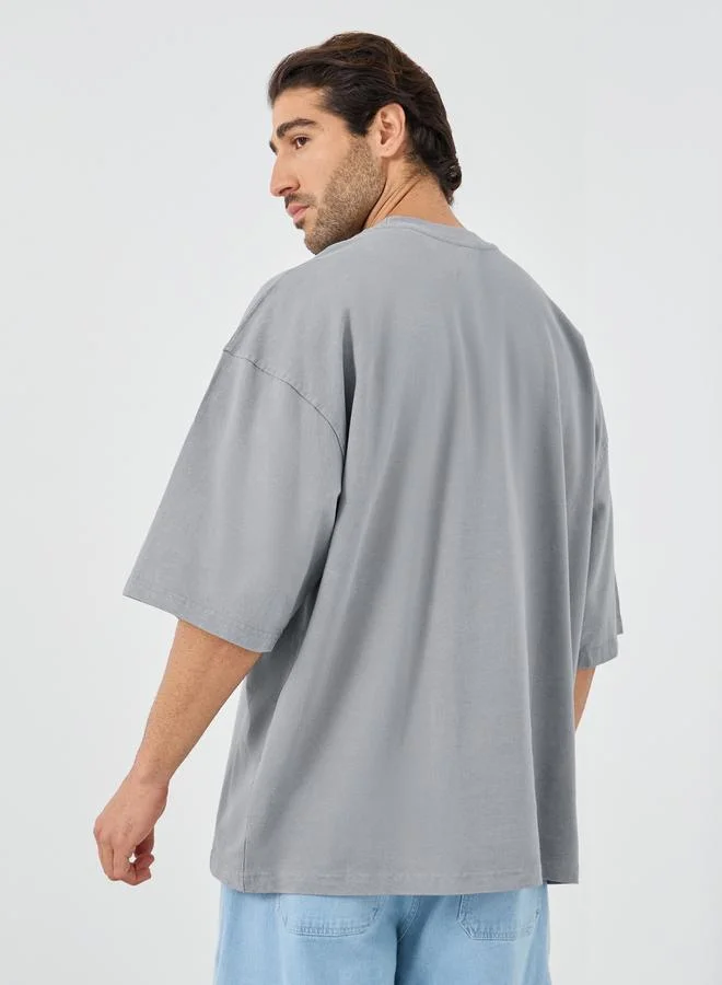 Styli Styli Slogan Print Oversized T-Shirt with Chest Pocket Detail