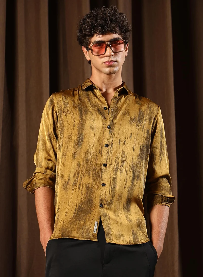 Campus Sutra Men Gleaming-Grazed Satin Shirt | Spread Collar , Long Cuffed Sleeves | Button Closure Curved Hem | Abstract Print Plain | Woven Fabric For Party & Evening Wear | Mustard Yellow