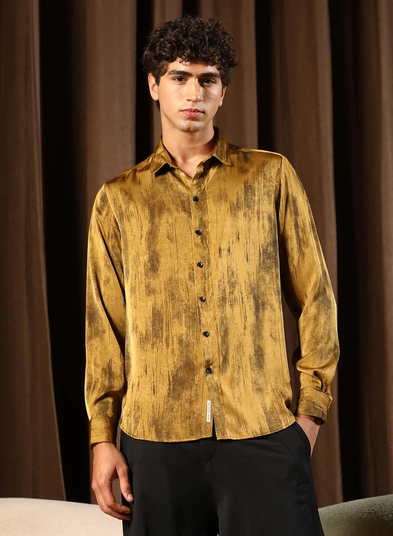 Campus Sutra Men Gleaming-Grazed Satin Shirt | Spread Collar , Long Cuffed Sleeves | Button Closure Curved Hem | Abstract Print Plain | Woven Fabric For Party & Evening Wear | Mustard Yellow