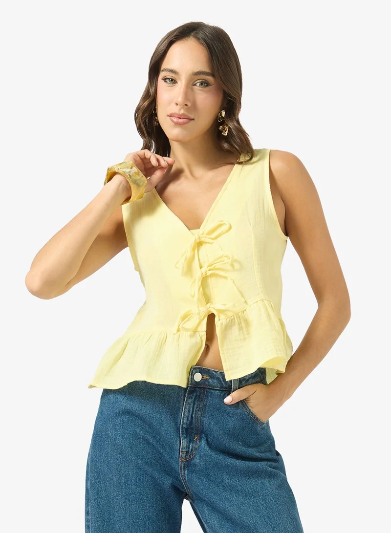 Ginger Bow Tie Up Detail Peplum Top