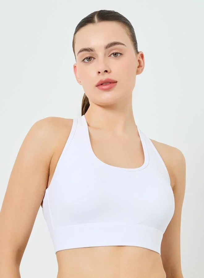 Styli Active  Women White Solid Strappy Back Sports Bra for Women | Best Price UAE