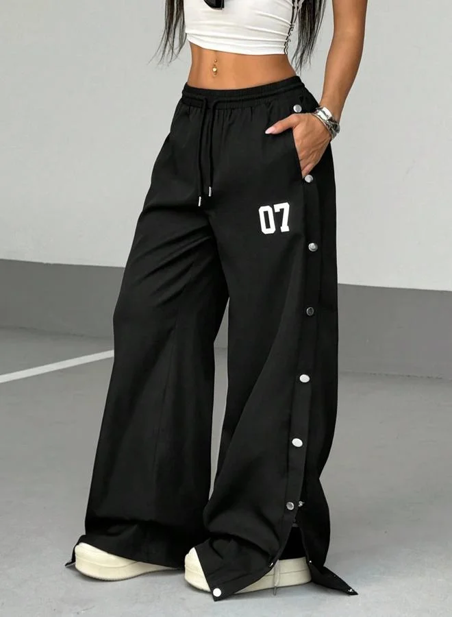 تايك تو بنطال بأرجل واسعة وأزرار جانبية كباس