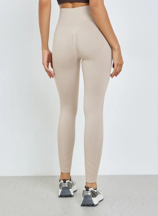 Styli Active  Beige Seamless Back Scrunch Leggings for Women | Best Price UAE