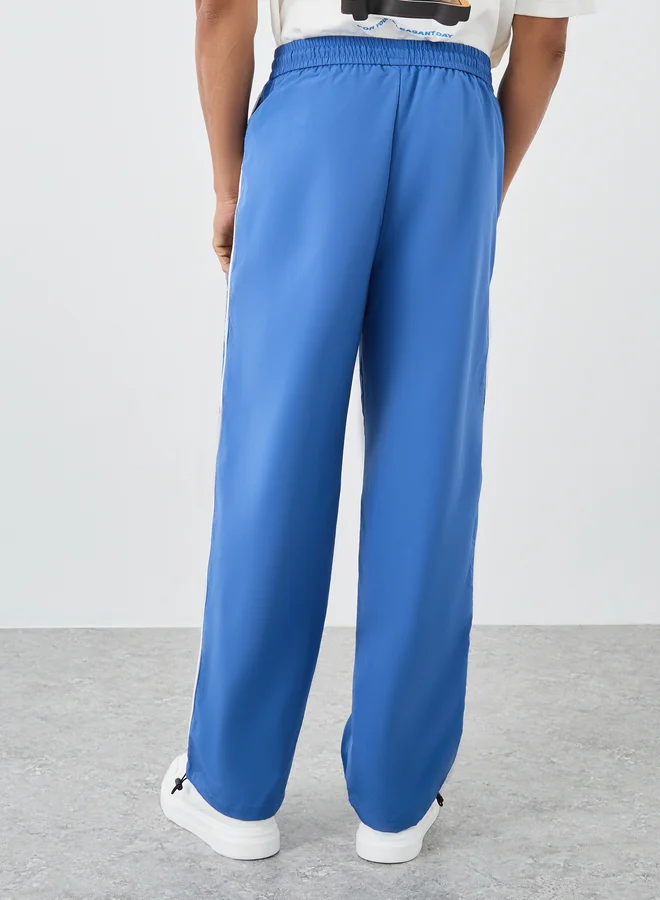 Styli Styli Woven Oversized Joggers with Side Piping and Adjustable Loop