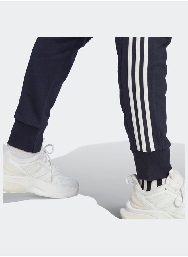 Essentials French Terry Tapered Cuff 3-Stripes Joggers - pzsku/Z0EBE8FE5B4A4717A85EEZ/45/_/1716213365/26f6c99a-a74a-4429-a209-5e19478b3bb8