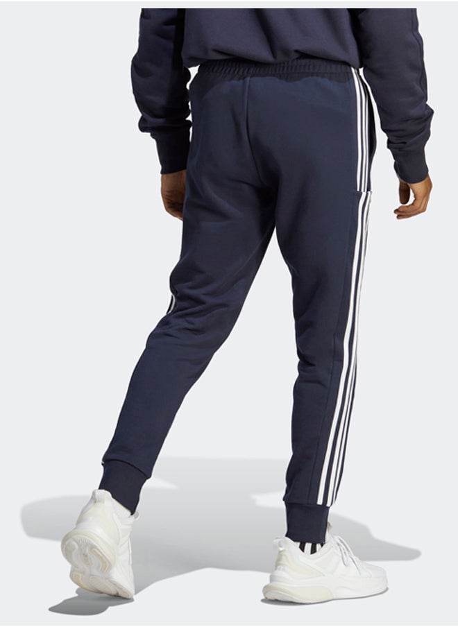 Essentials French Terry Tapered Cuff 3-Stripes Joggers - pzsku/Z0EBE8FE5B4A4717A85EEZ/45/_/1716213366/8f41cf54-a60c-458e-88be-b2bdf0ab7dfc