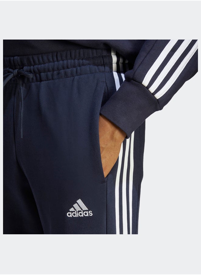 Essentials French Terry Tapered Cuff 3-Stripes Joggers - pzsku/Z0EBE8FE5B4A4717A85EEZ/45/_/1716213367/a8972662-0bd7-4970-89f0-2dd05b830dc7