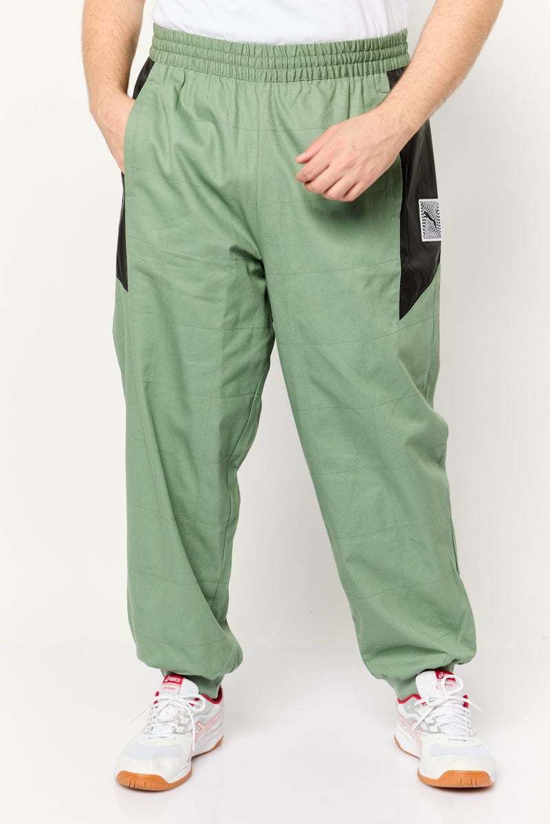PUMA Men Sportswear Fit Porsche Outdoor Track Pants, Olive/Black - Image 1