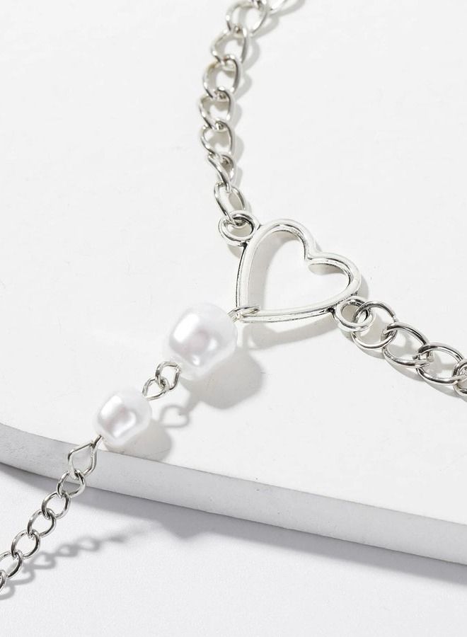 Silver bracelet with distinctive link chain decorated with pearls with heart-shaped ring design - Image 3