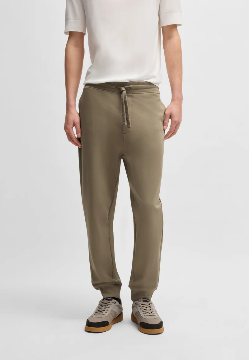 هوجو بنطلون رياضي قطني بتصميم تيري وطبعة شعار