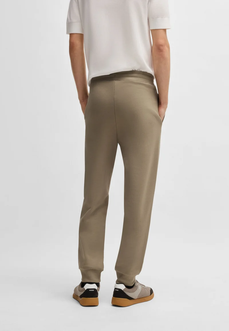 هوجو بنطلون رياضي قطني بتصميم تيري وطبعة شعار