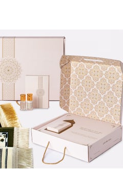 A prayer mat box with the design of the door of the Kaaba with two perfume bottles