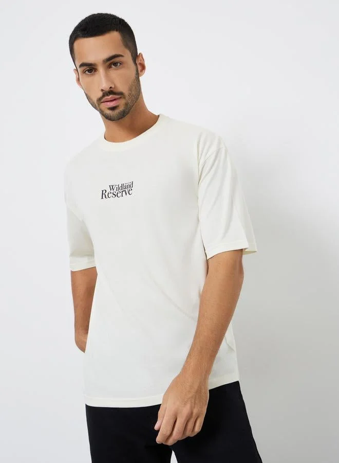 Styli Men Cream Graphic Print Oversized T-Shirt