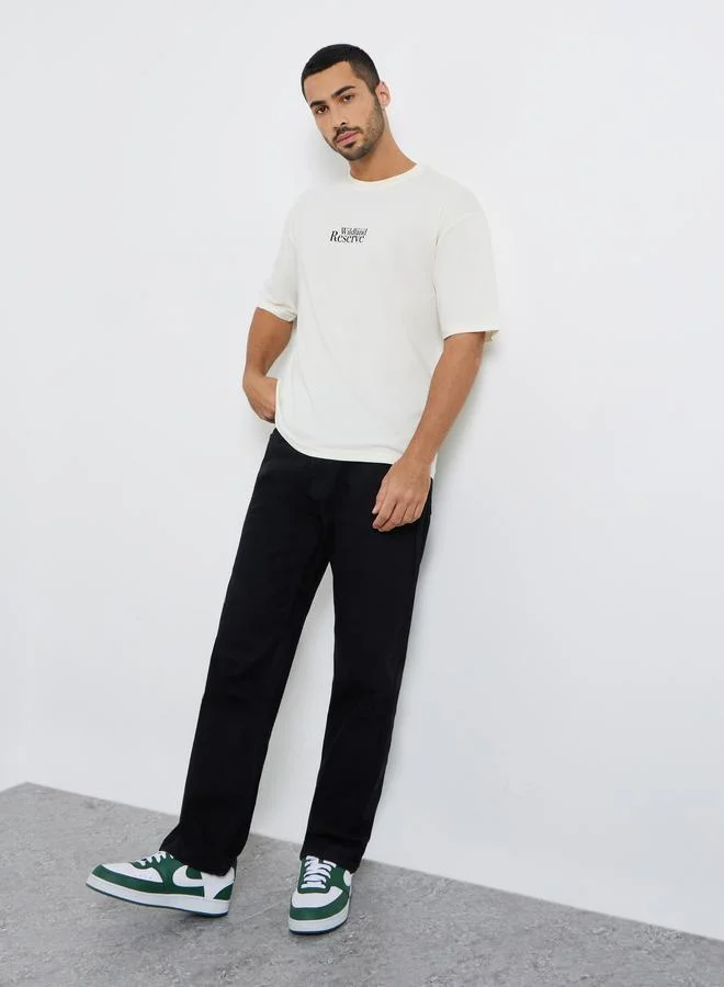 Styli Men Cream Graphic Print Oversized T-Shirt