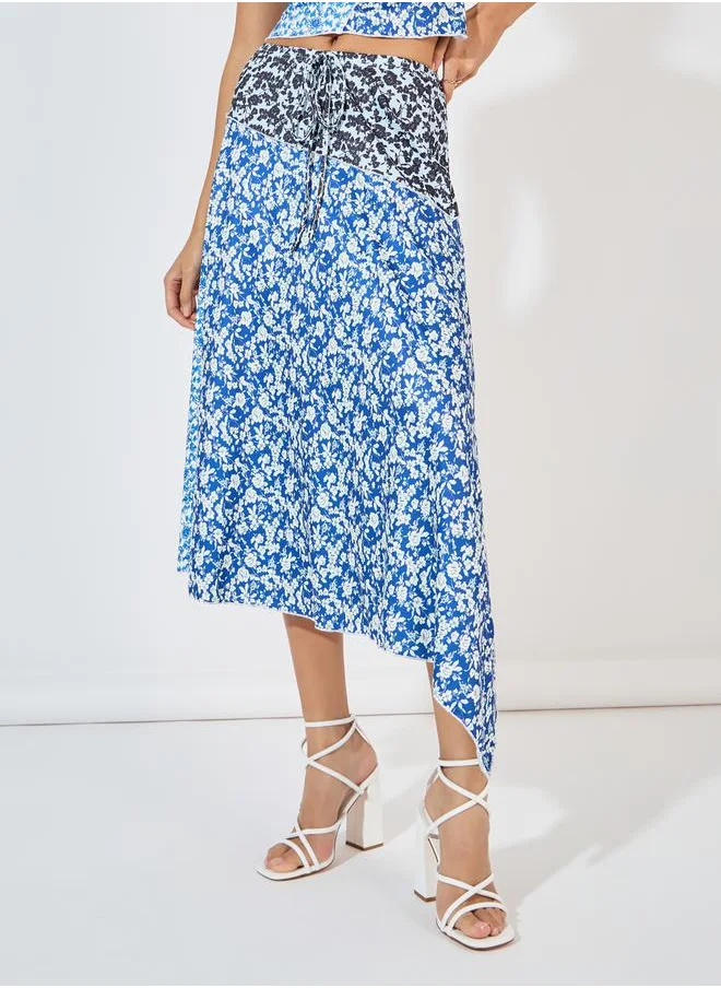 Styli Floral Asymmetric Hem Midi Skirt with Overlock Seam