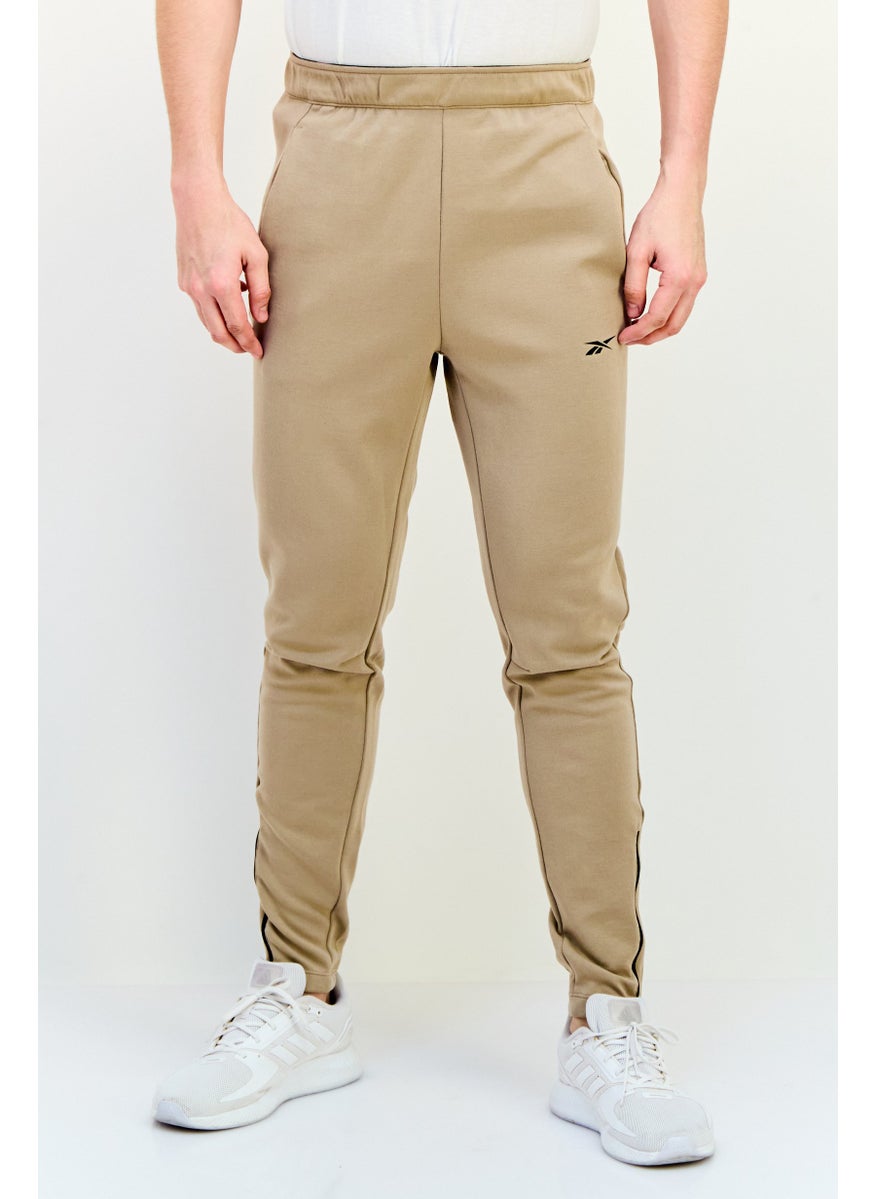 Reebok Men Sportswear Fit Drawstring Training Track Pants, Tan  - Image 1