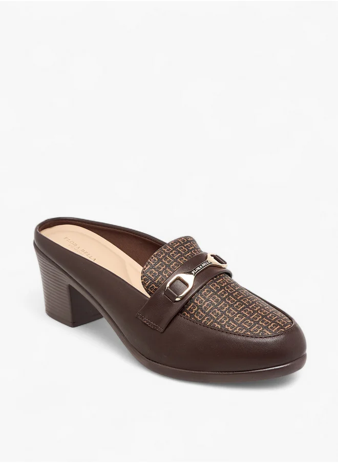 فلورا بيلا من شو إكسبرس Women's Textured Slip-On Mules with Metal Accent and Block Heels