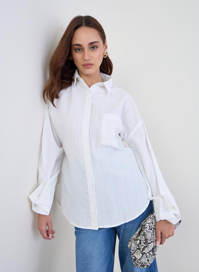 ستايلي بلوزة واسعة بتفاصيل بارزة الملمس مع أكمام بأساور - Image 1