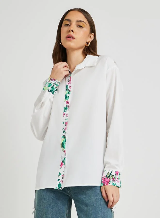 تايك تو قميص واسع بياقة مفرودة وتفاصيل طبعات