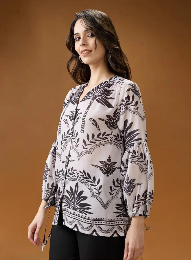 جلو باص بلوزة بطبعة وأكمام منفوخة بياقة عميقة