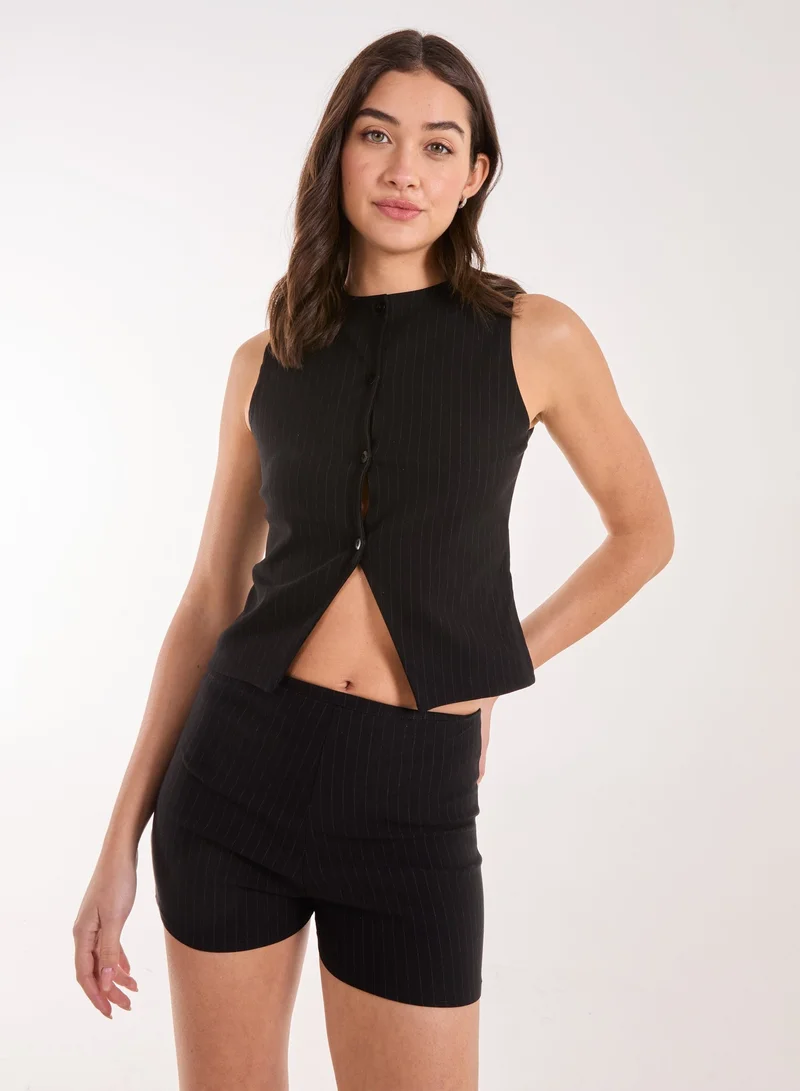 بينك فانيلا سترة طويلة بياقة مدببة وأزرار أمامية