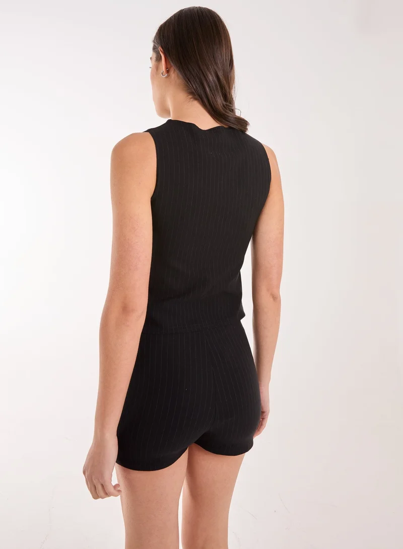 بينك فانيلا سترة طويلة بياقة مدببة وأزرار أمامية