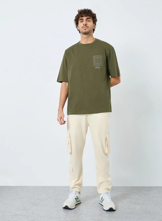 Styli Men Olive Graphic Print Oversized Cotton T-Shirt