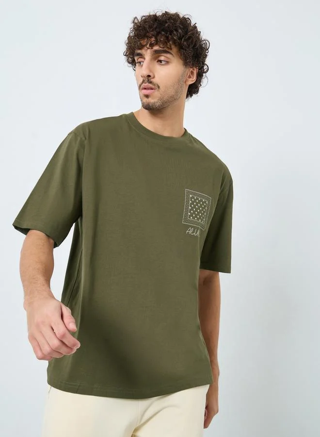 Styli Men Olive Graphic Print Oversized Cotton T-Shirt