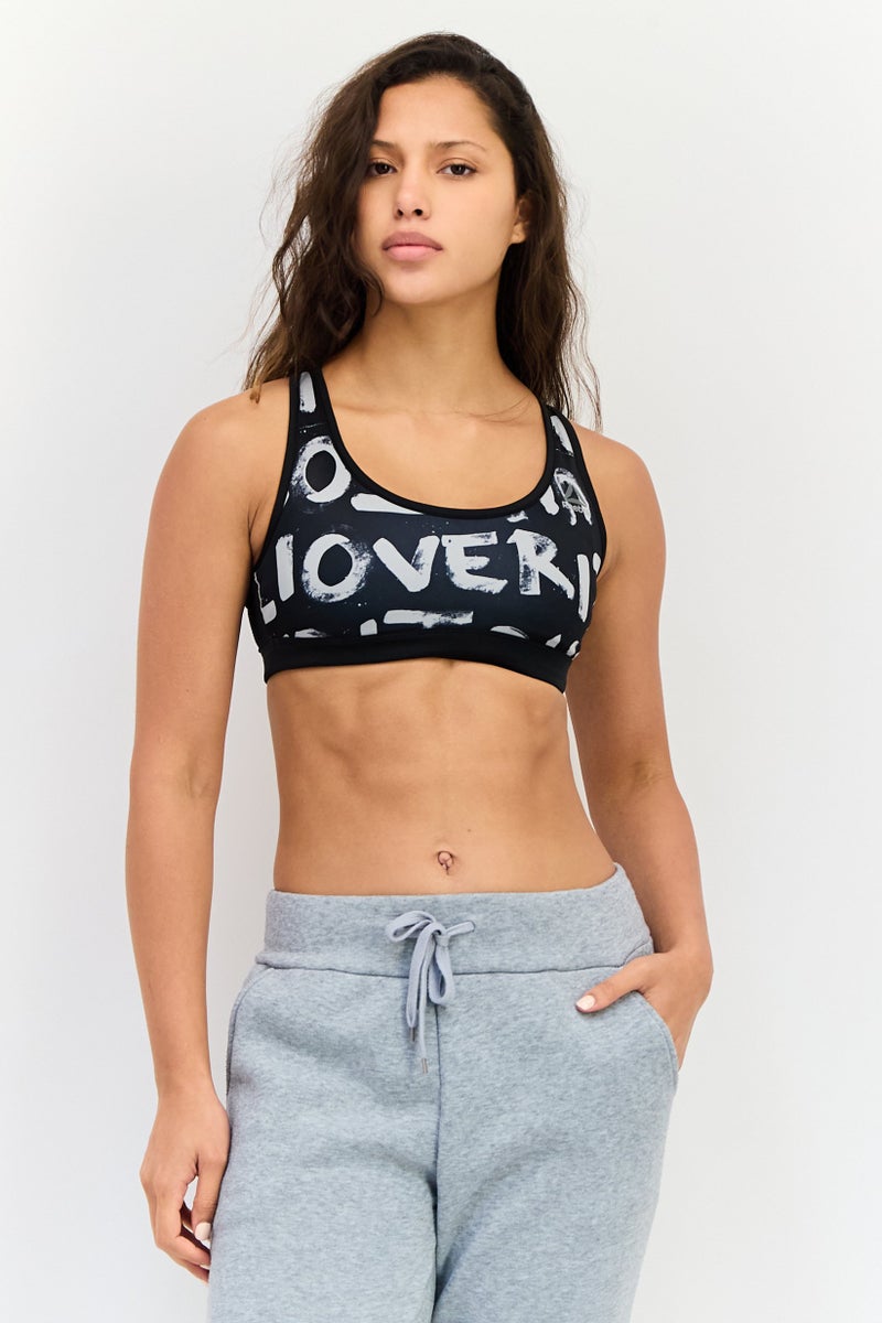 Reebok حمالة صدر رياضية للنساء بدون حشوة بطباعة جرافيك، متعددة الألوان - Image 1