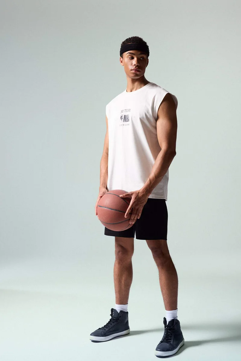 ديفاكتو NBA Wordmark Printed Oversize Tank Top