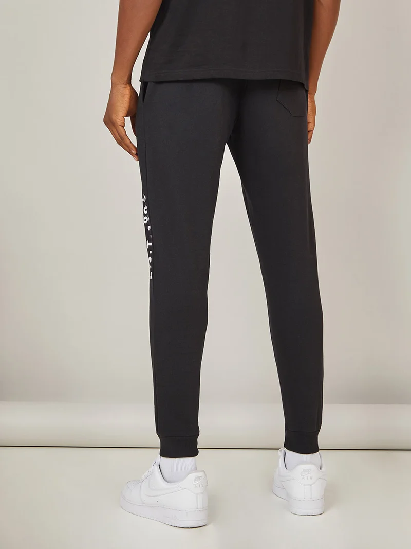 Styli Text Print Detail Slim Fit Jogger with Pockets