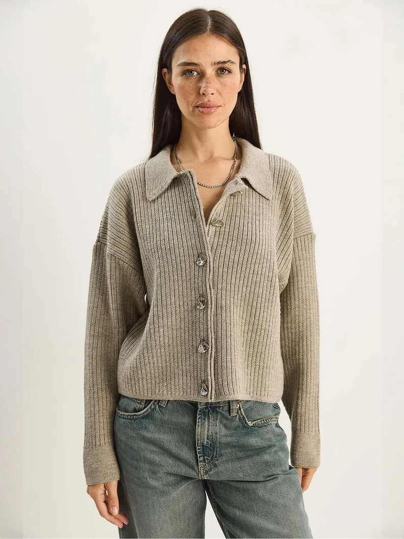 بيانكو لوتشي كارديجان لوكسي محبوك بأزرار