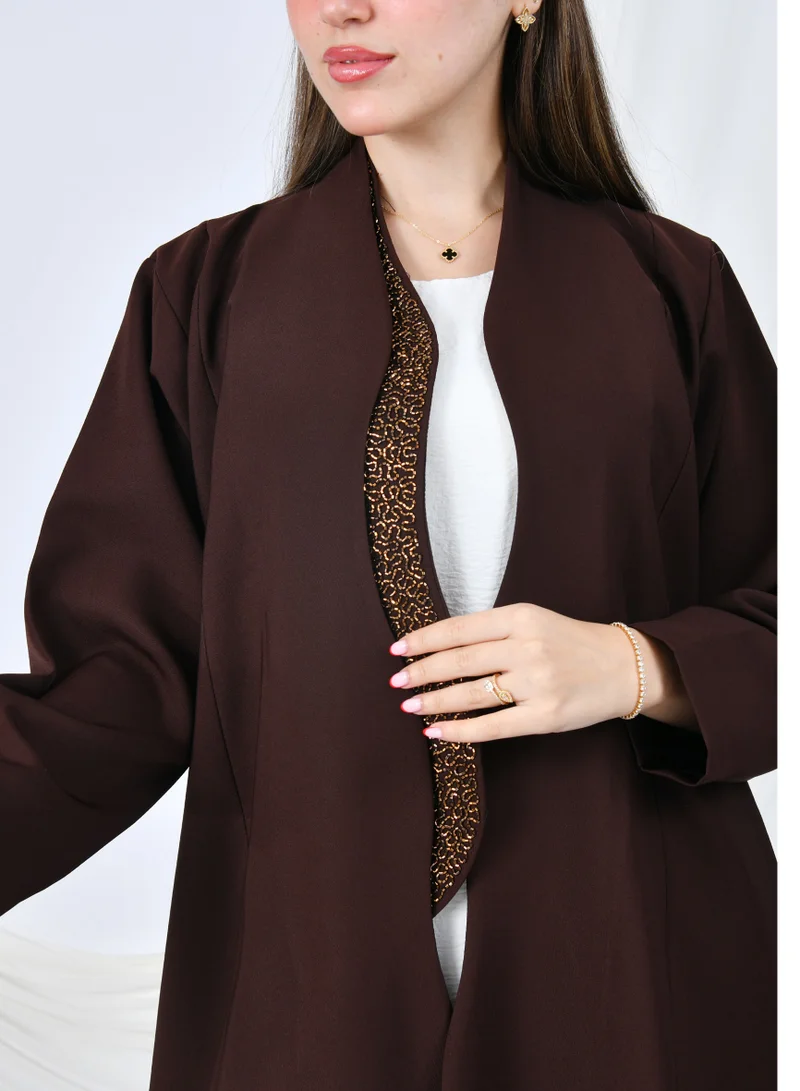 HAWRAA ABAYA An elegant abaya that combines simplicity and luxury with a quarter-length hem embellished with shawl detailing at the front edges | Brown with gold shawl detailing