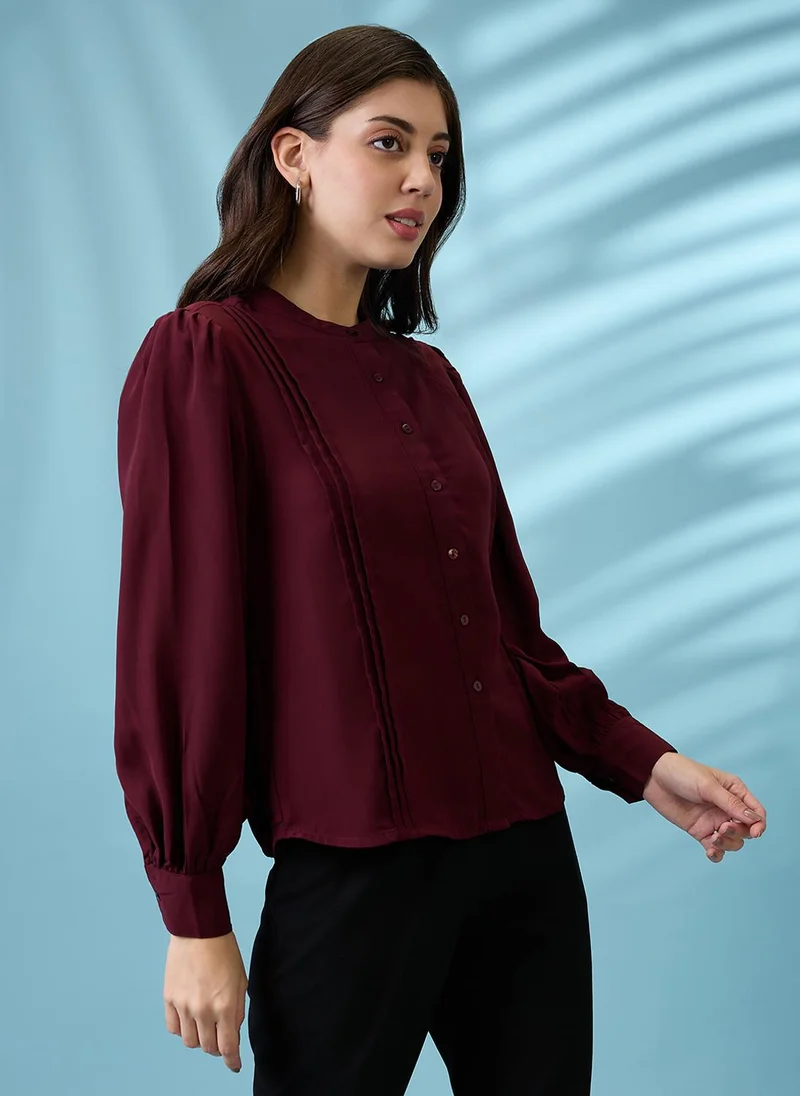 جلو باص بلوزة نسائية بياقة ماندرين مطوية وأكمام بأساور للعمل من جلوبس بلون عنابي